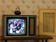 “American TV” showing the footage. It’s called American TV because it’s colored, and no one in Ireland really had that.
