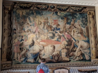 The walls were lined with huge tapestries, each telling part of a story